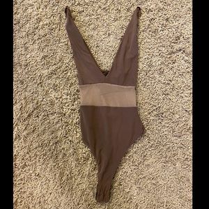 Beige bodysuit with mesh middle